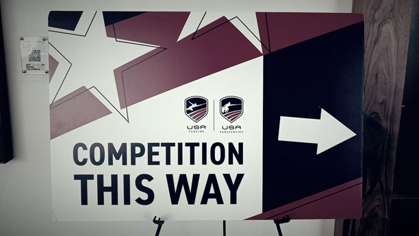 Competition this way sign.